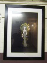 A reproduction framed and glazed Art Deco style print of lady