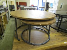 A modern laminated metal supported and circular topped occasional table with matching table to