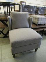 A modern heron bone fabric upholstered chair