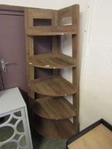 A modern beech effect five tier corner whatnot