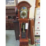 A modern Brazillian mahogany Westminster chime moon dial long case clock
