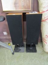 A pair of Monitor Audio speakers on stands