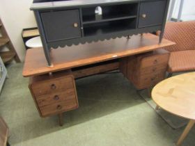 A modern walnut veneered kneehole desk, the top over two pedestals containing three drawers