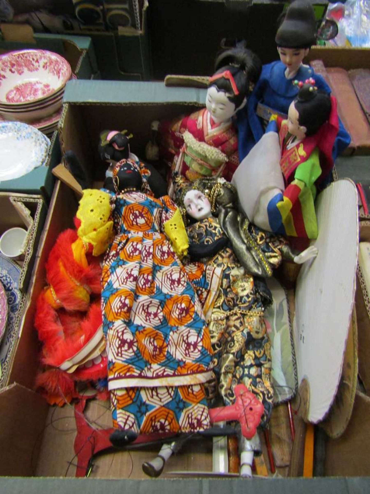 A tray of Chinese style dolls/puppets