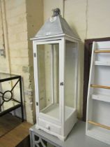 A modern Dekor white painted oversized wood and glass lantern with trinket drawer to base