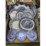 Two trays of blue and white ceramic plates to include Willow pattern