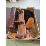 A box containing early 20th century brushes, coat rack, etc