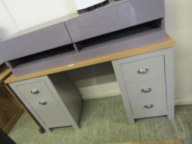 A reproduction oak topped-effect twin pedestal desk with drawers