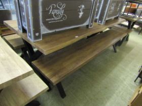 A large oak effect picnic bench along with two matching bench seats