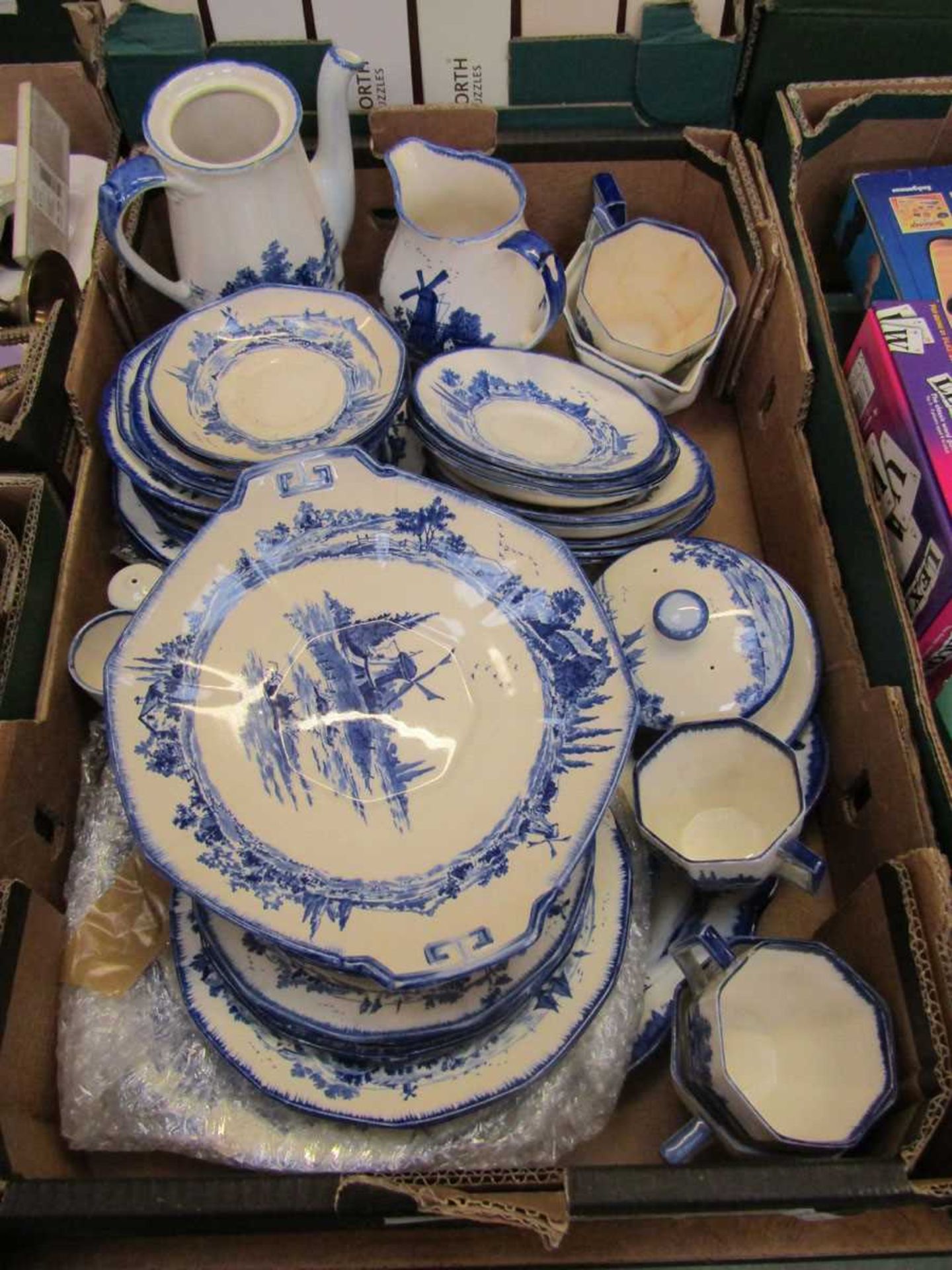 A tray containing a part Royal Doulton 'Norfolk' tea set to include plates, cups, saucers, jugs,