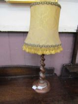 An early 20th century converted tapering barley twist stemmed table lamp