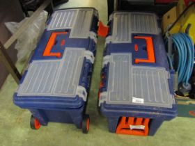 Two blue PVC toolboxes containing a quantity of tools