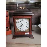 A mahogany cased quartz mantel clock by 'English Elegance' on bracket feet