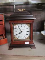 A mahogany cased quartz mantel clock by 'English Elegance' on bracket feet