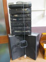 An Aiwa hi-fi stacking system with a pair of matching speakers