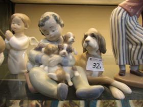 Three Lladro ceramic figurines of children and animals