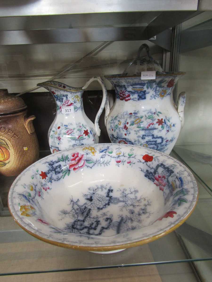 A selection of three oriental style white glazed items of ceramic consisting of wash jug and bowl