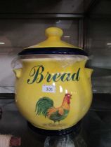 A large mid-20th century ceramic bread bin with rooster design