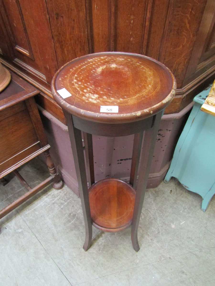 An Edwardian mahogany inlaid two tier jardiniere stand