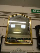 A reproduction gilt framed bevel glass wall mirror 89cm x 59cm