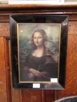 A framed and glazed print of Mona Lisa