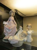 A Lladro ceramic figurine of girl holding flowers