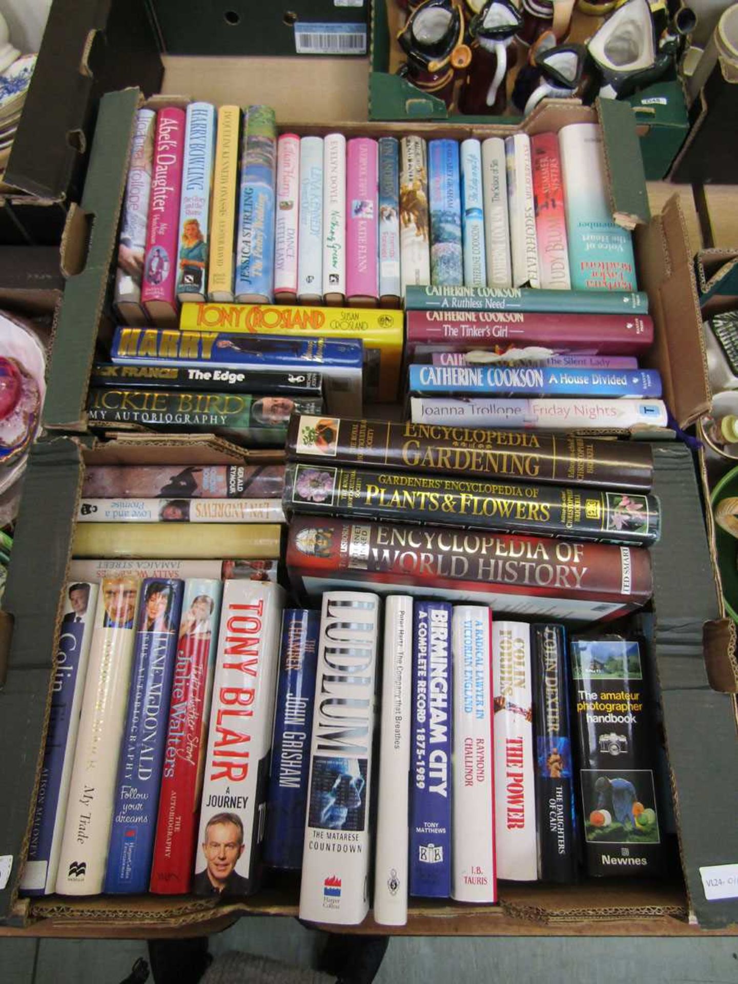 Two trays of hardback books by various authors