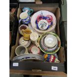 A tray of assorted pottery and porcelain to include Poole Pottery bowls and vase, cranberry glass,