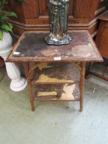 A bamboo three tier occasional table