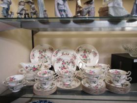 A large assortment of Wedgwood 'Charnwood' tableware comprising of two sauce boats, dinner, tea