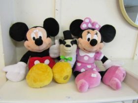Mickey and Minnie mouse from the Disney store together with a soft toy of badger