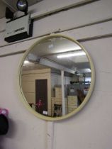 A mid-20th century white Perspex circular wall mirror