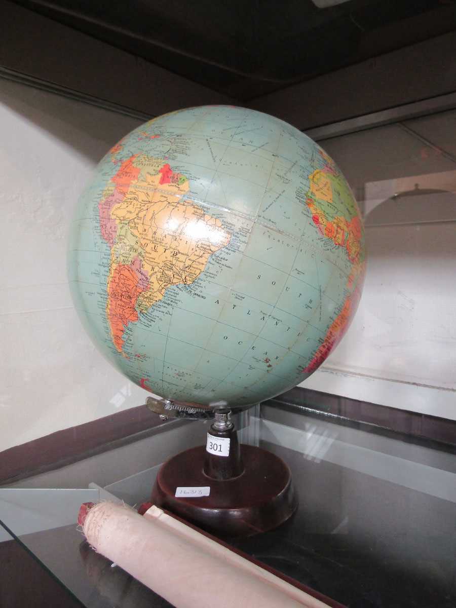A 20th century globe on wooden stand