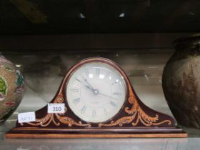 A painted wooden cased Napoleon hat style quartz mantle clock