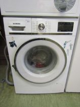 A Siemens washing machine Unsure of functionality, cannot plumb and test in saleroom. Inside
