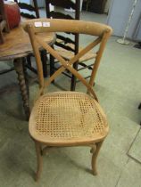 An early 20th century beech rail back bergere seated bent wood style hall chair