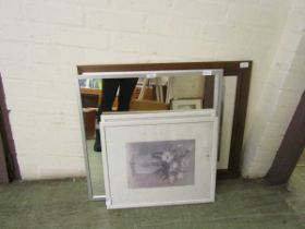 A pair of framed and glazed prints of still life together with two silver coloured framed mirrors