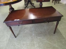 A reproduction mahogany coffee table with two drawers