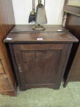 An early 20th century stained pine low level single door cupboard