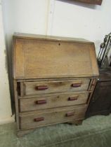 An early 20th century oak fall front bureau