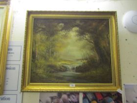 A reproduction gilt framed oil on canvas of woodland river scene