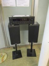 A pair of Mission speakers on stands together with a Teac AM/FM stereo receiver model no. AG790