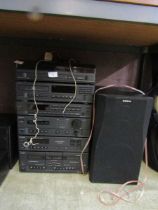 A Sony stacking Hifi system with a pair of speakers and remote