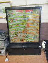 An early 20th century arcade wooden cased 'Nine Hole' gaming machine No key for cash box.