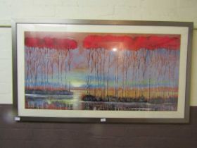 A large modern framed print of tree scene