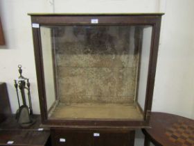 An early 20th century glazed pine display case