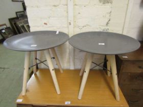 A pair of modern beech four legged stools with grey circular seats