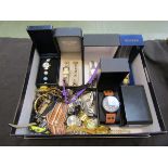 A box containing a quantity of modern watches, some in presentation boxes