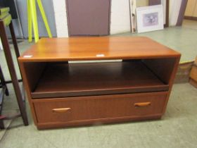 A mid-20th century teak low level cabinet having open storage above single drawer