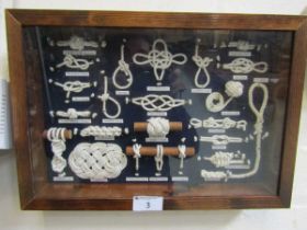 A reproduction mounted sample of maritime knots